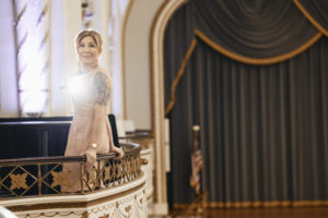 Woman on theater balcony